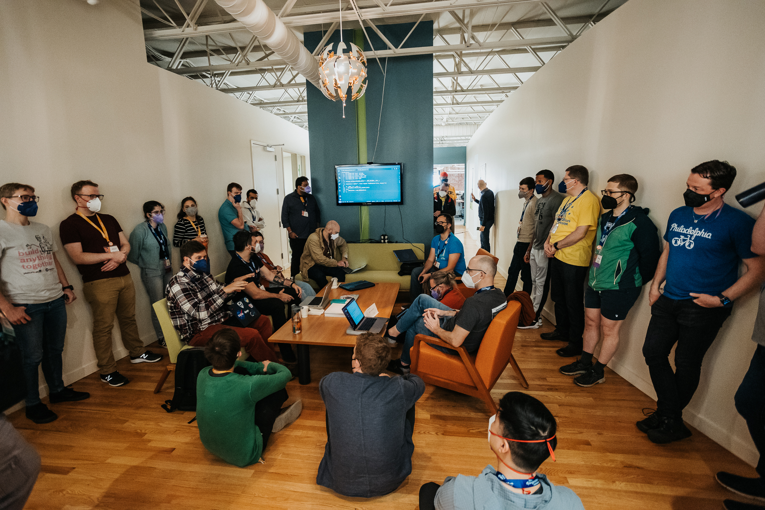Attendees sitting at a code demonstration
